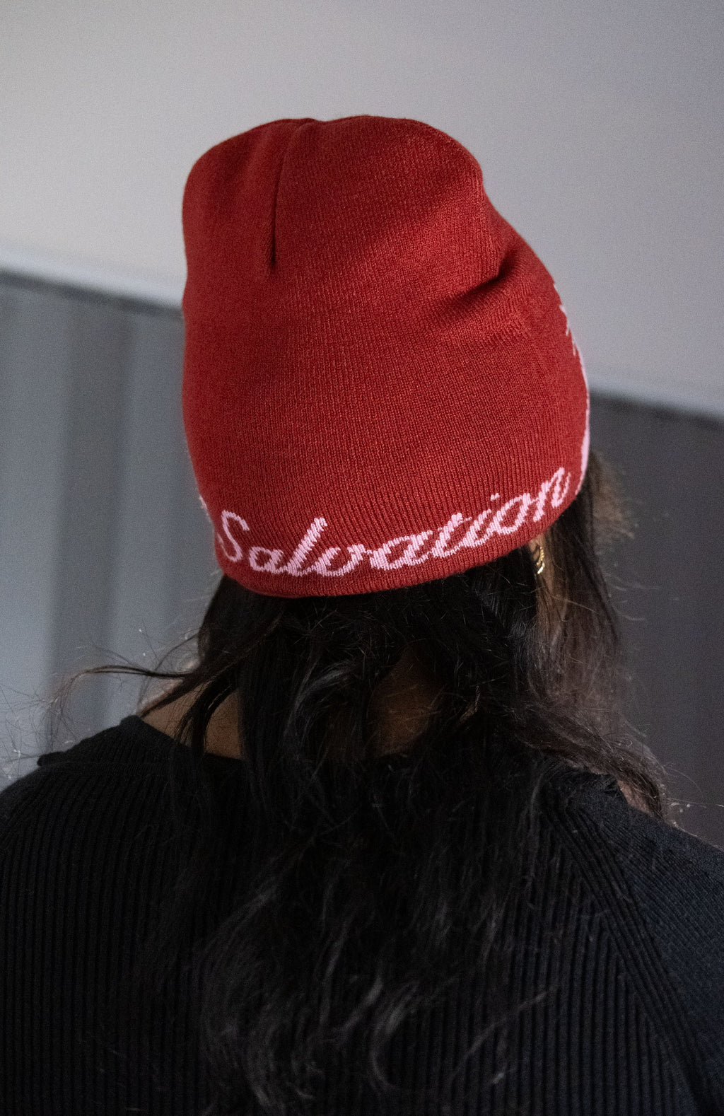 Red beanie with helmet of salvation on a white background. LOVE GOD BIG Christian clothing brand streetwear faith-based apparel. Back of beanie.