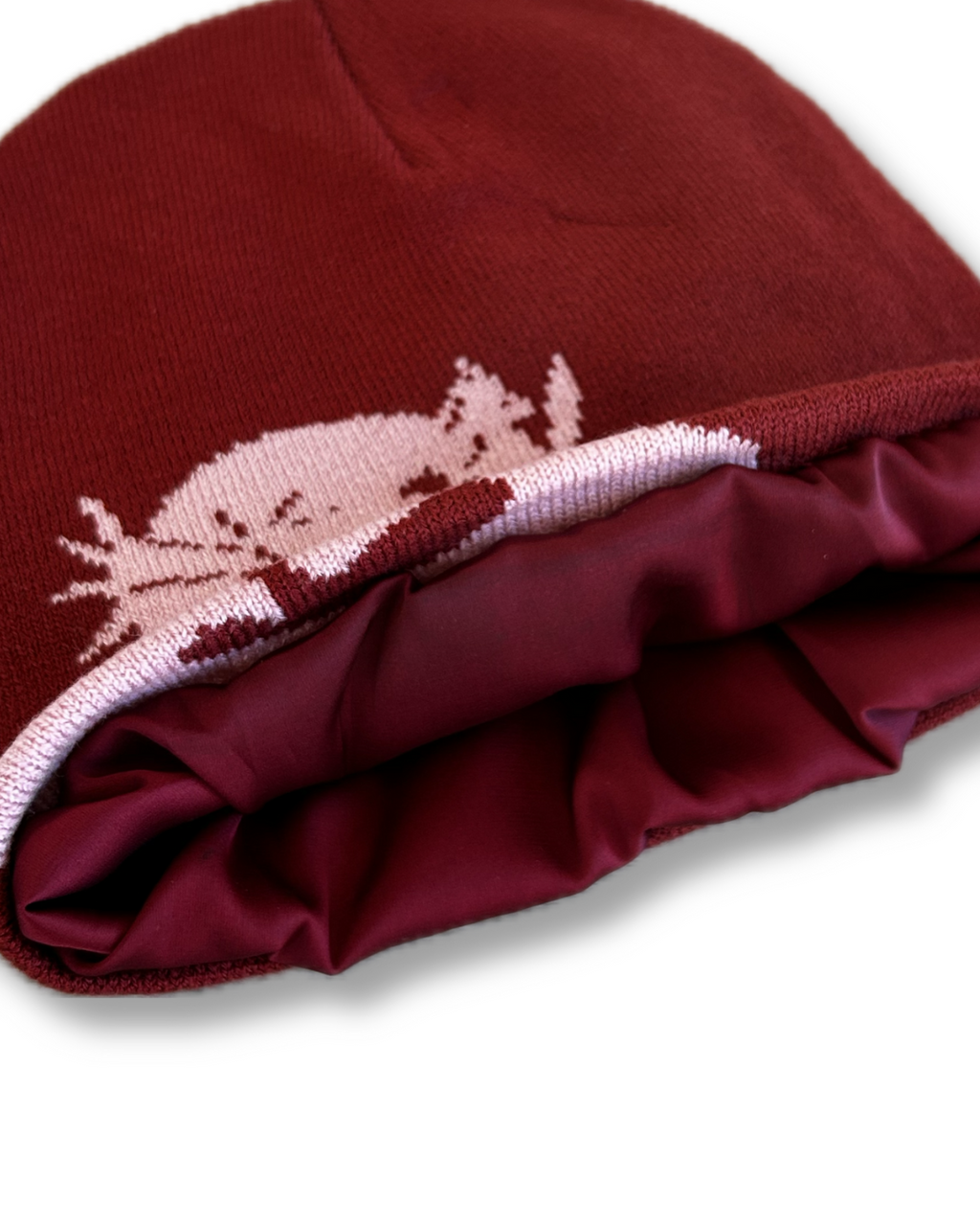 Red beanie with helmet of salvation on a white background. LOVE GOD BIG Christian clothing brand streetwear faith-based apparel. Satin inner lining of beanie