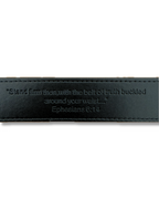 Black leather belt with engraved Ephesians 6:14 verse on a white background. LOVE GOD BIG Christian streetwear clothing brand. New Zealand Faith-based apparel.