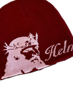 Red beanie with helmet of salvation on a white background. LOVE GOD BIG Christian clothing brand streetwear faith-based apparel. Close-up. Front.
