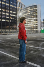 Red Jesus vs Fame hoodie. Side view.