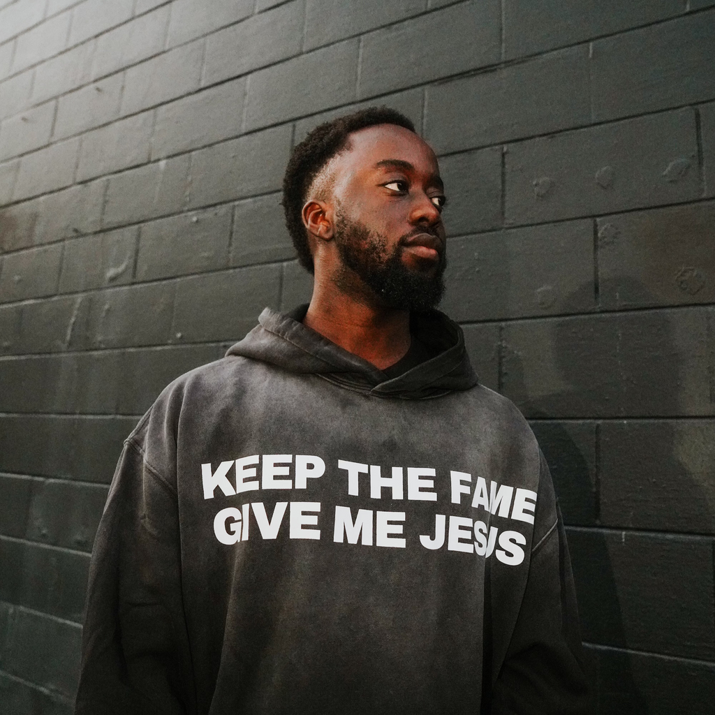Front Black washed gradient oversized hoodie. Front pocket. 100% cotton. soft terry cotton inner. screenprinted logo "Keep the Fame Give me Jesus". Galatians 1:10. 